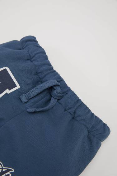 بنطلون سويت بانتس بيبي اولادي بطبعة شعار وقصة عادية نيلي فاتح