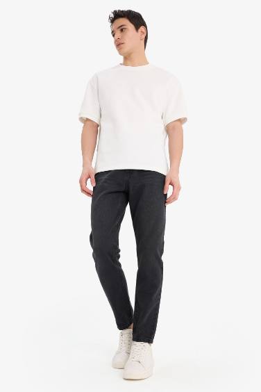 بنطلون جينز 90’S سليم فيت برجل ضيقة وخصر عالي أسود