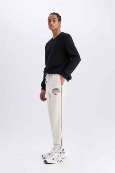 DeFactoFit NBA Milwaukee Bucks Jogger Eşofman Altı Standart Fit Cepli Esnek Bantlı Paça Skuba Dalgıç Kumaş