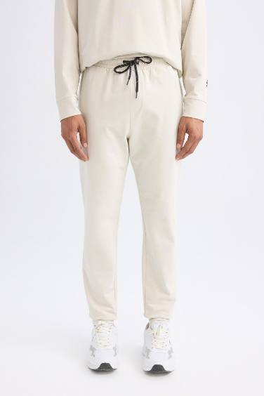 DeFactoFit Sporcu Jogger Eşofman Altı Slim Fit Dar Kesim Standart Paça Beli Paçası Lastikli