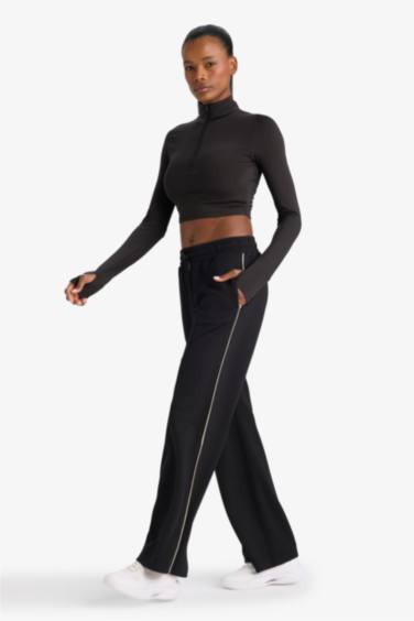 بنطرون رياضي منسوج برجل واسع وايد ليج