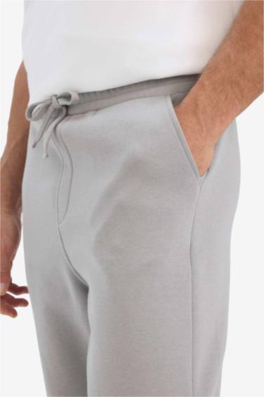 سروال قماش سميك قصة عادية برجل عادي بجيب