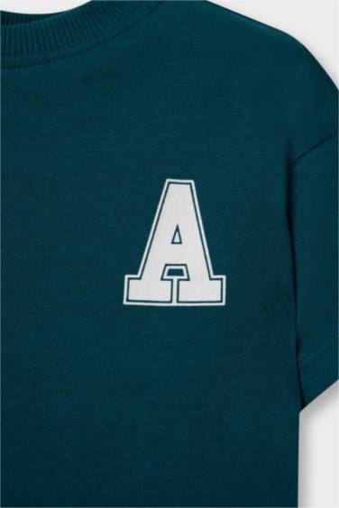 تيشيرت بيبي ولادي نص ردن بطبعة شعار قصة عادية