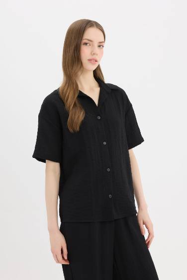 قميص كم طويل اوفر سايز بمظهر كتاني