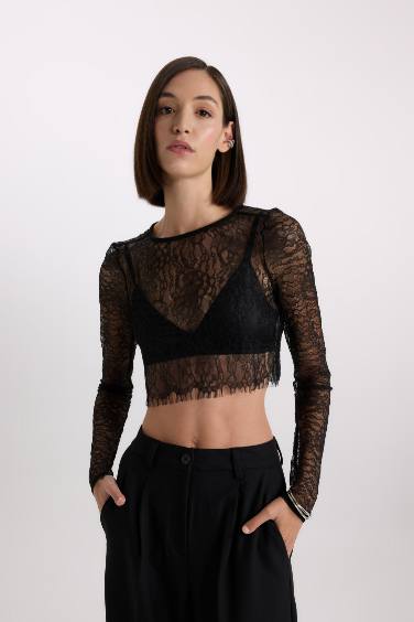 Chemisier à manches longues en dentelle à col rond