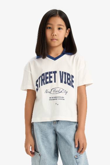 تيشيرت بولو بنات نص كم بطبعة شعار أوفر سايز برقبة بولو