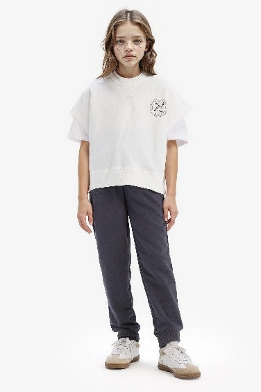 سويت شيرت بناتي بطبعة شعار اوفر سايز بياخة مستديرة