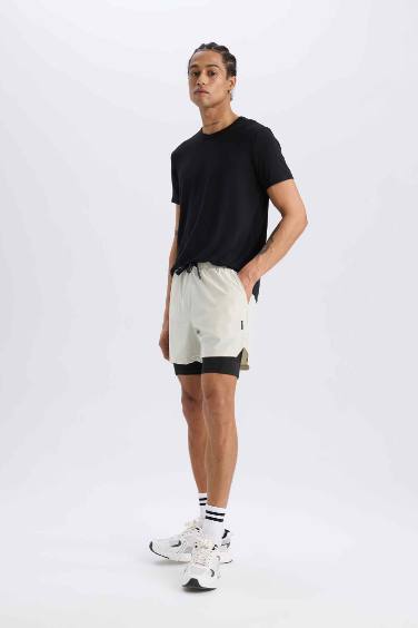 DeFactoFit Slim Fit Dar Kesim Sporcu Penye Taytlı Şort