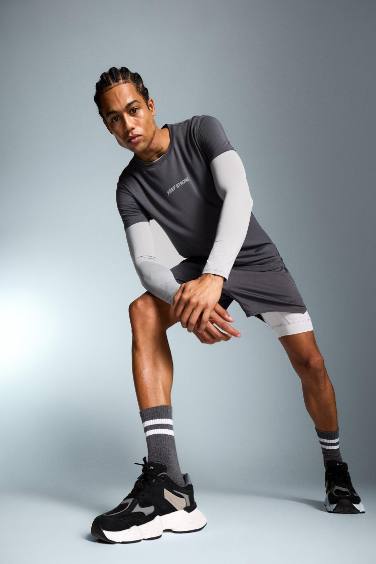 شورت رياضي سليم فيت مطبوع بليجن من DeFactoFit