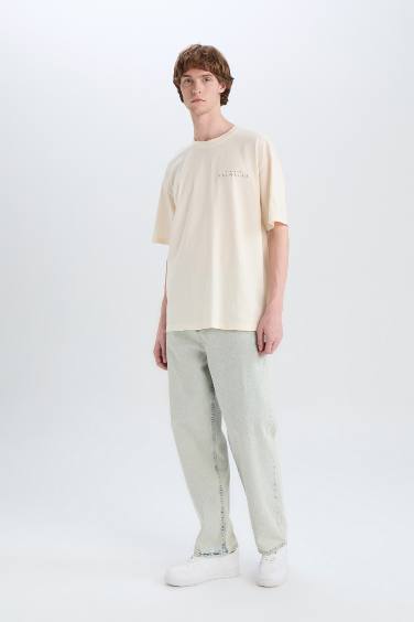 تيشيرت قطن أوفر سايز بطبعة من الخلف برقبة مستديرة