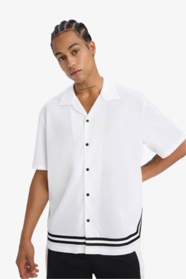 تيشيرت بولو نص ردن اوفر سايز بطبعة من الخلف