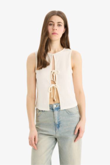 بلوزة كت منسوج قصة عادية وياخة مستديرة