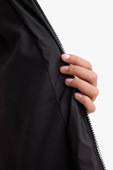 Doudoune longue imperméable à capuche et fermeture zip Coupe régulière