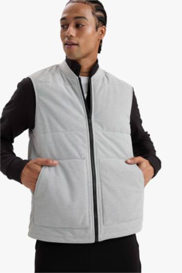 Gilet zippé à col montant et poches Coupe régulière