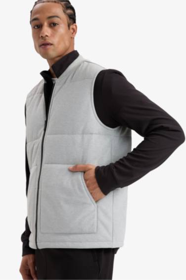 Gilet zippé à col montant et poches Coupe régulière