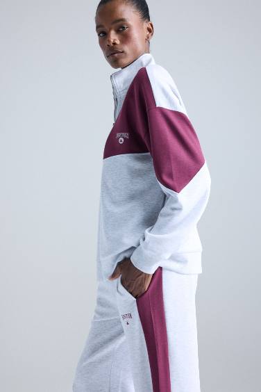 سويت شيرت اوفر سايز رياضي بياقة نص سوسته من بوسطن سيلتكس