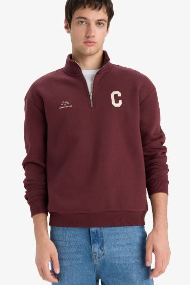 سويت شيرت مطبوع أوفر سايز بياقة عالية بنصف سحاب