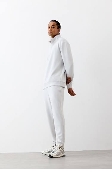 بنطلون بجامة رياضي جوجر قصة عادية من DeFactoFit