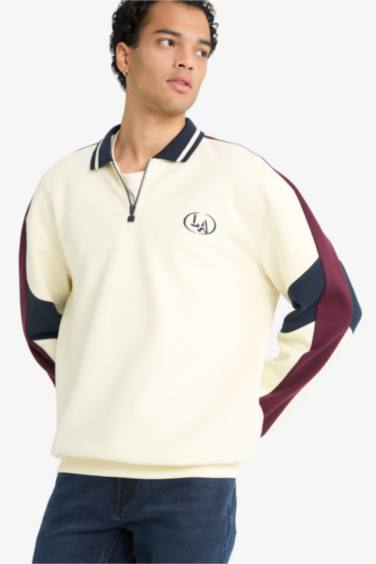 سويت شيرت اوفر سايز بياقة عالية بسوسته