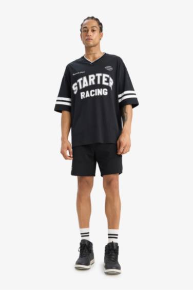 تيشيرت نص ردن قطن قصة فضفاضة وطبعة من الخلف