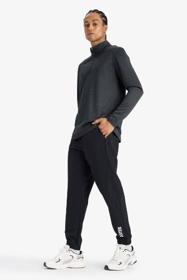 بنطلون بجامة رياضي جوجر منسوج سليم فيت من DeFactoFit