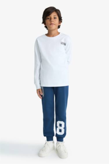 Pantalon de survêtement à taille élastique avec imprimé pour garçon