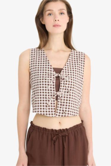 بلوزة نص ردن فلورال مخصر بياخة V