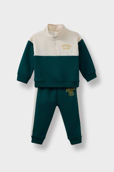 طقم بيبي اولادي سويت شيرت وسويت بانتس بطبعة شعار - قطعتين