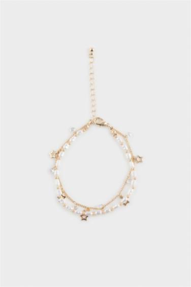 Женский браслет золотого цвета с жемчугом