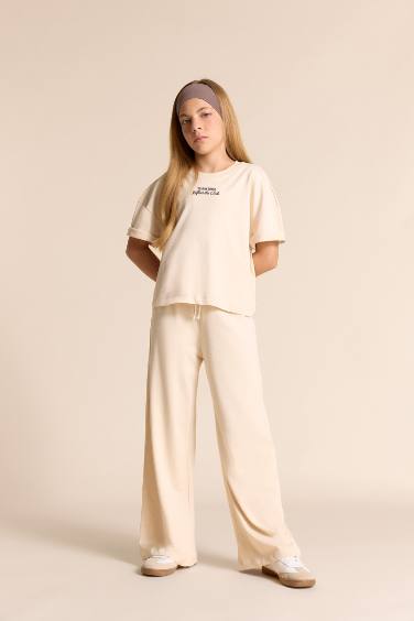 طقم بناتي تيشيرت نص كم وبنطلون - قطعتين