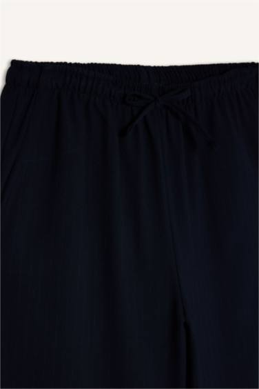 بنطرون وايد ليج برجل واسع بجيب وخصر عادي