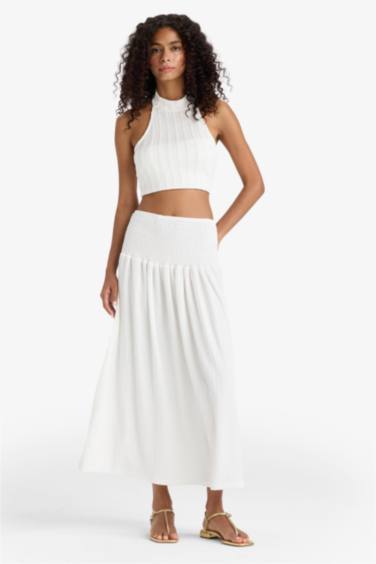 Белая макси-юбка А-силуэта с высокой талией и рюшами