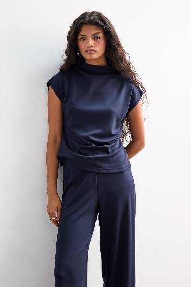 Top sans manches à col montant en piqué Coupe slim