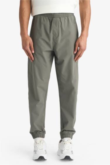 سروال رياضي منسوج سليم فيت