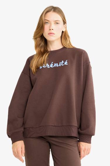 سويت شيرت مطبوع اوفر سايز برقبة مستديرة