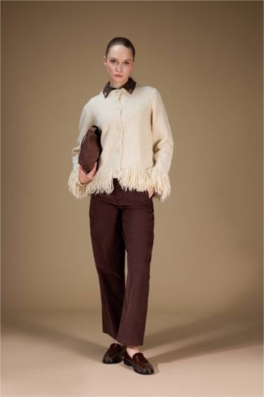 جاكيت تريكو قصة عادية بياخة مستديرة