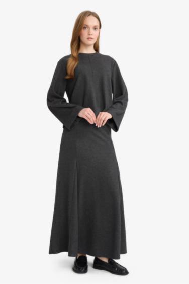 بلوزة تريكو ردن طويل بقصة فضفاضة