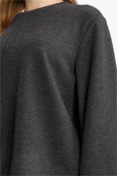 بلوزة تريكو ردن طويل بقصة فضفاضة