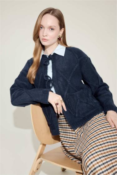 جاكيت تريكو قصة عادية بياخة مستديرة