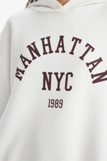 سويت شيرت برسمة مدينة قصة مريحة بغطاء للرأس