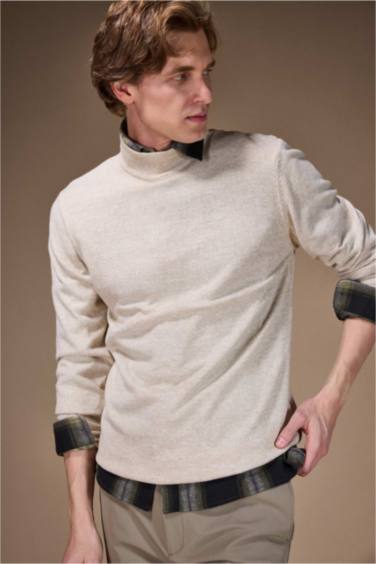 بلوز تريكو سليم فيت بياخة مدورة