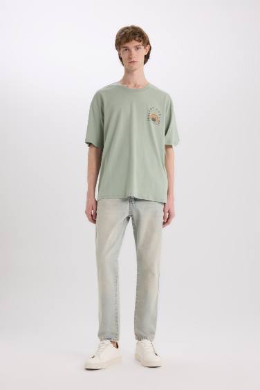 تيشيرت اوفر سايز مطبوع من الخلف برقبة مستديرة