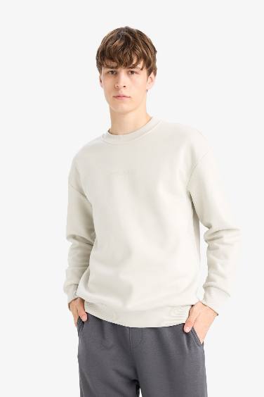 سويت شيرت مطبوع أوفر سايز برقبة مستديرة