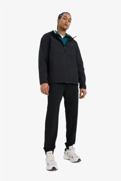 جاكيت مطر قصة عادية بغطاء للرأس مقاوم للماء من DeFactoFit