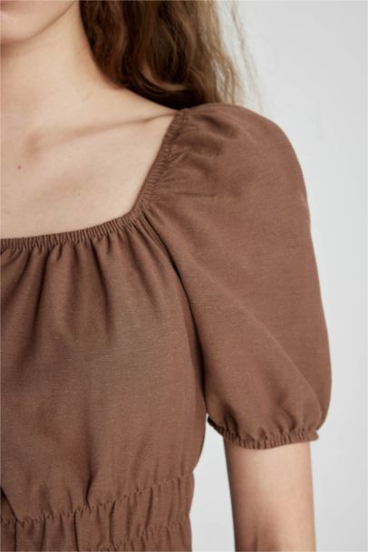 فستان قصير كتان نص ردن بياخة مربعة