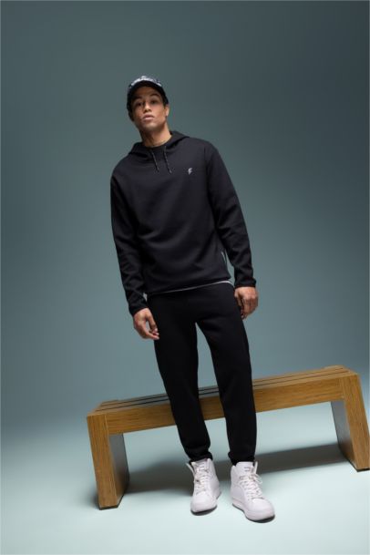 سويت شيرت قصة عادية بغطاء للرأس من DeFactoFit