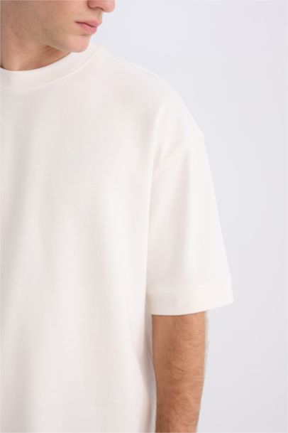 تيشيرت تقيل قصة فضفاضة بياخة مستديرة