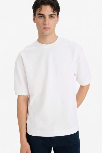 تيشيرت نص كم قصة فضفاضة قماش يسمح بمرور الهواء