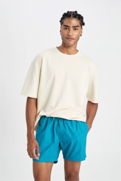 شورت بحر قصير ببطانة شبكية