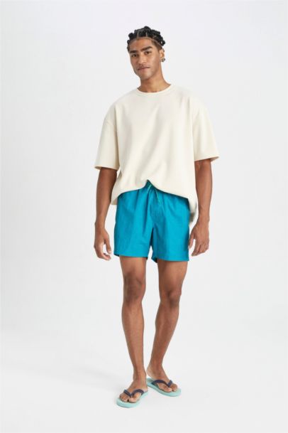 شورت بحر قصير ببطانة شبكية